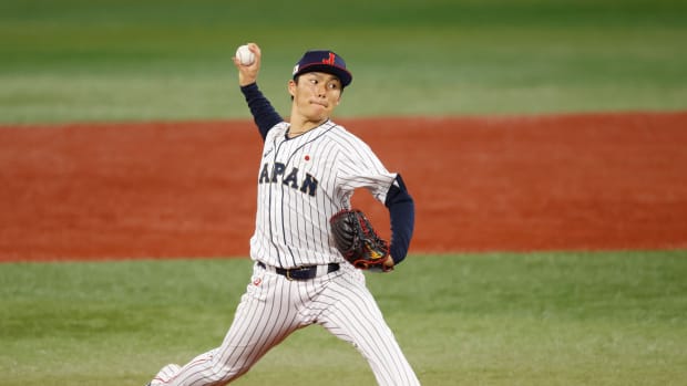Aug 4, 2021; Yokohama, Japan; Team Japan pitcher Yoshinobu Yamamoto (17) throws a pitch against Korea in a baseball semifinal match during the Tokyo 2020 Olympic Summer Games at Yokohama Baseball Stadium.